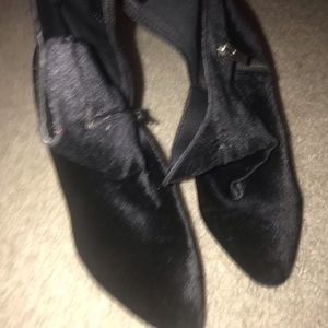 Pointed toe black high heeled boots